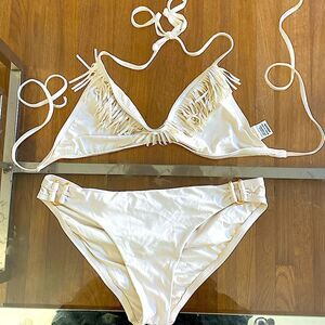 L’Space fringe bikini bottoms have gold hardware accents